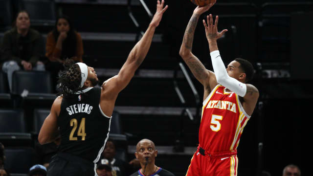 Mar 8, 2024; Memphis, Tennessee, USA; Atlanta Hawks guard Dejounte Murray (5) shoots as Memphis Grizzlies forward Lamar Stevens (24) defends during the second half at FedExForum. Mandatory Credit: Petre Thomas-USA TODAY Sports